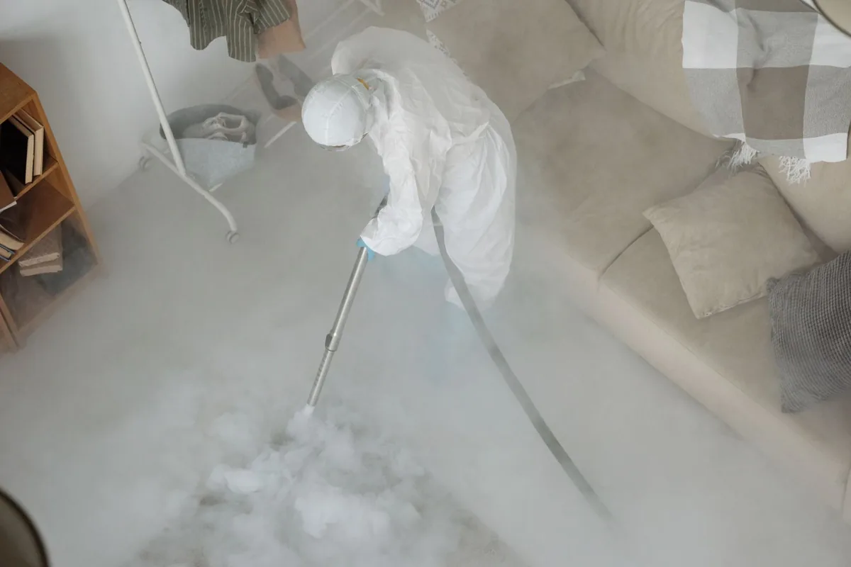 Biohazard cleanup technician in protective equipment, Dixon, KY